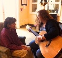 Playing Guitar to Elderly